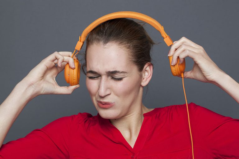 Girl wearing really loud headphones