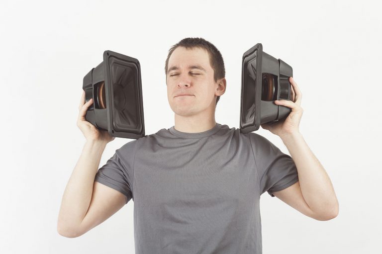 Man with loud speakers close to his ears 